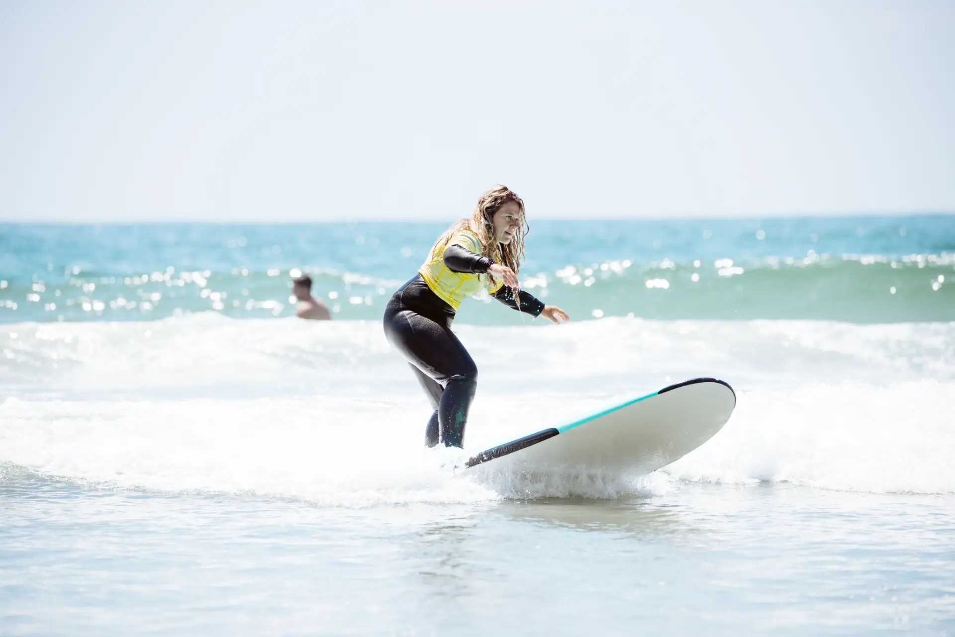 Learning to surf on a whitewater wave